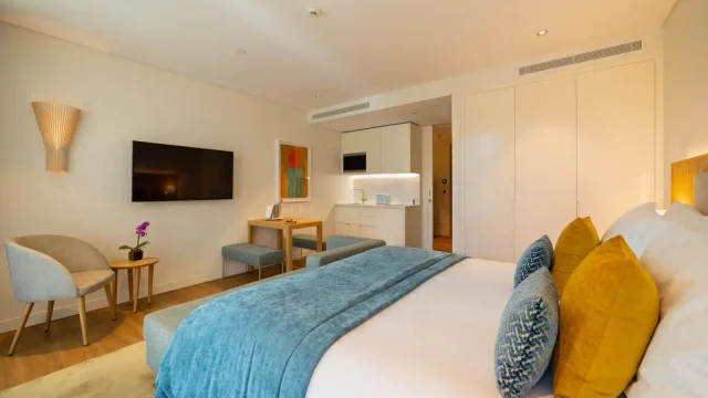 Modern hotel room with cozy decor