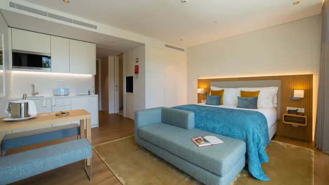 Modern studio with kitchen and bed